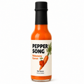 A 5 fl oz bottle of Pepper Song Habanero Carrot hot sauce on a clean white background. The bottle is filled with bright orange-red sauce, has a black cap, and a cream-colored label featuring an illustration of a carrot and bold black text.