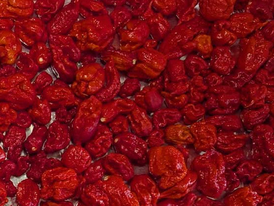 A tray of food filled with Carolina Reaper peppers